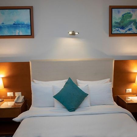 Rehana Plaza Hotel Il Il Cairo Esterno foto A bedroom at the hotel